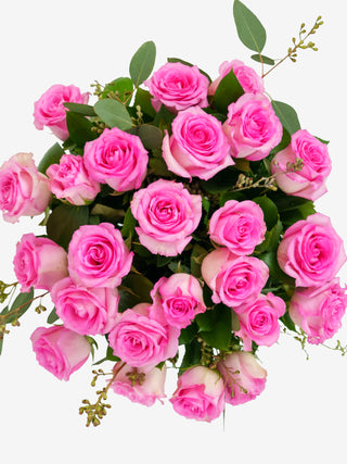 A top view of pink roses long stem bouquet. 36 long stem pink roses with vase included.