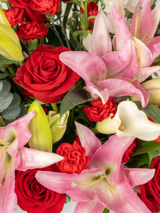 pure affection luxury bouquet with premium pink and white roses in an elegant vase.